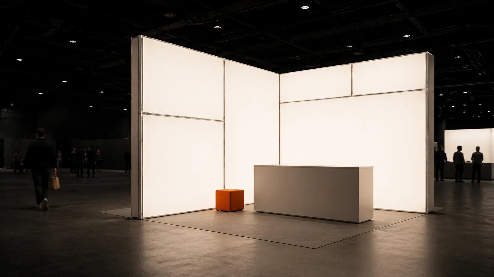 A corner stand of illuminated panels with a counter in front